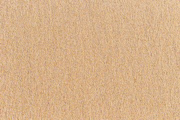 Fototapeta na wymiar Bright sand texture on the beach for background