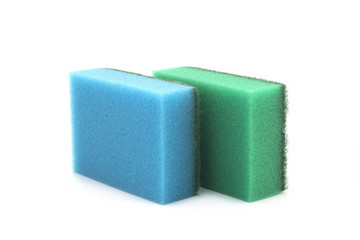 Four yellow sponges for washing dishes isolated on white background