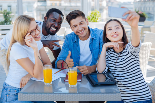 University friends taking selfie outdoors