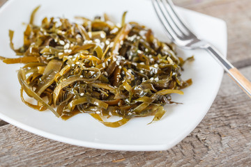 seaweed salad with sesame seeds and oil.
