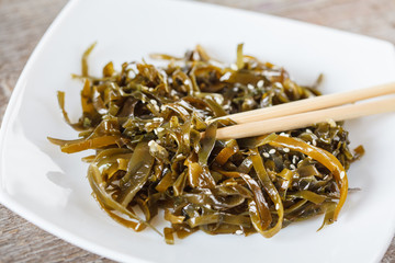 seaweed salad with sesame seeds and oil.