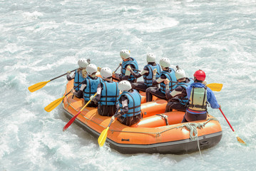 Group of people rafting on white water, active vacations, team concept - obrazy, fototapety, plakaty