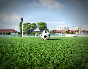 Soccer Football on the green grass of Soccer field.