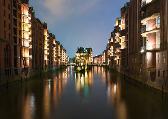 Fototapeta premium old warehouse district Speicherstadt in Hamburg, Germany illuminated at night