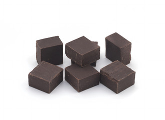 Seven pieces of chocolate isolated on white, peeled and retouched photos