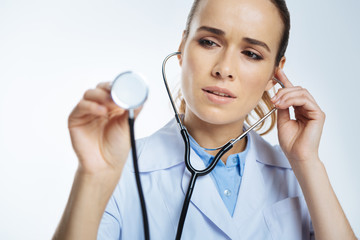 Scared doctor listening to patient heart