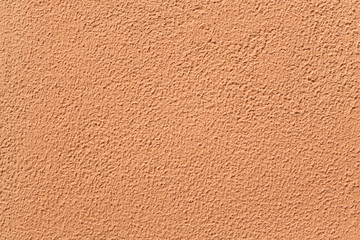 Terracotta painted stucco wall.