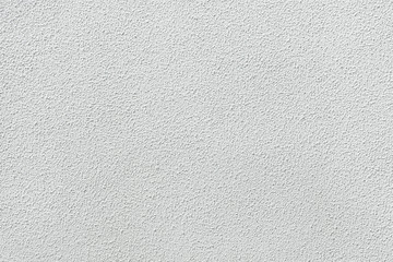 White painted stucco wall.