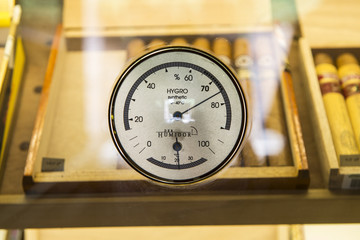 Hygrometer and cigars background 