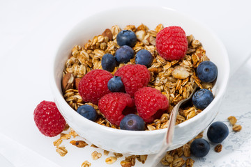 cottage cheese with granola and fresh berries, closeup