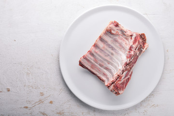 Raw meat. On a wooden background. Top view. Free space for text.