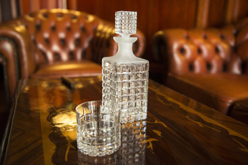 Glass carafe on the luxury background