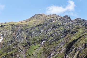 Mountain landscape of the high rocky Fagaras mountains in Carpathians, near the Transfagarasan road and balea lake, Romania