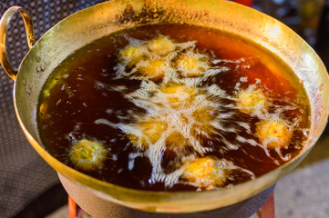 Deep frying, cooking process food is submerged in hot oil