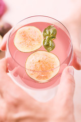 Pink cocktail with fig