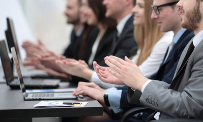 business team applauding the speaker at the meeting