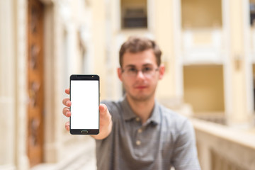 Man hand holding smart phone with white screen
