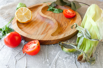 wooden cutting board with vegetables