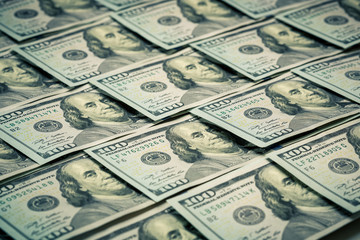 Lot of one hundred dollar bills close-up background