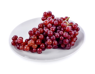 Red grape bunch in white plate  isolated on white background