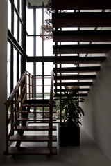 Silhouette of wooden staircase.