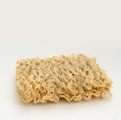 piece of instant noodles on paper white background,copy space