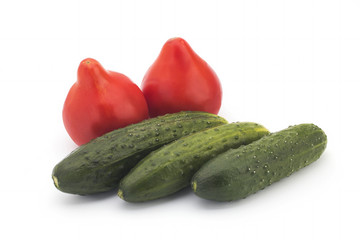 Tomatoes and cucumbers on a white background