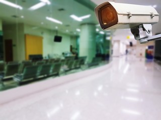 CCTV, security indoor camera system operating with blurred image of hospital background, surveillance security technology concept