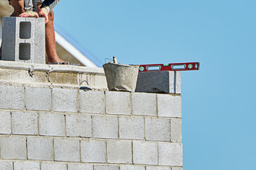 Mason on laying bricks