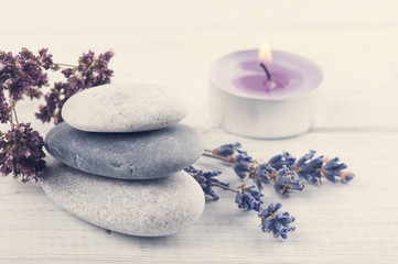 Obraz na płótnie Canvas Stack of pebbles, lavender flower