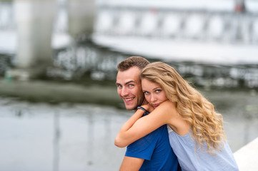 Loving couple walking park and the river.