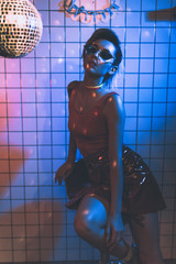 girl in sunglasses on disco party
