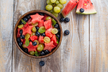 Summer fruit salad with watermelon, blueberry and grapes. Space for text © happy_lark