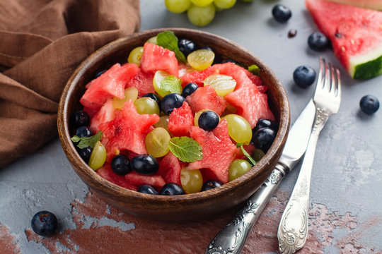 Summer fruit salad with watermelon, blueberry and grapes. Space for text