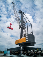 Mobile harbor crane for loading/discharging container at industrial port.