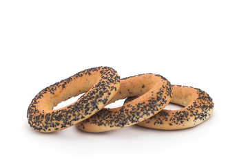 A delicious bagel with poppy seeds isolated on a white background