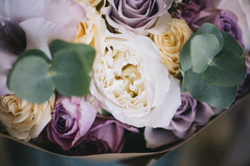 Beautiful fresh flower bouquet with eucalyptus,roses and english roses, close up view