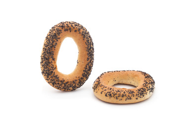 A delicious bagel with poppy seeds isolated on a white background