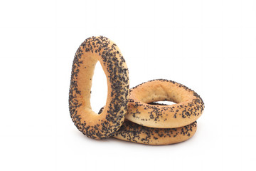 A delicious bagel with poppy seeds isolated on a white background