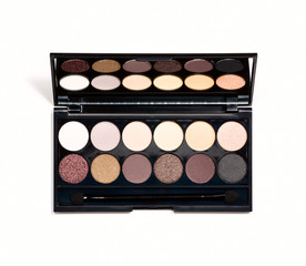 palette of eye shadow close-up reflected in mirror.