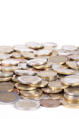 Many euro coins on white background.