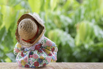 girl wearing a hat The back turned on the wooden floor.