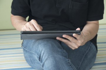 A person texting the tablet