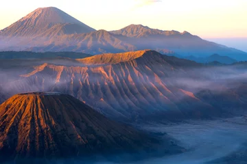 Schilderijen op glas Mount Bromo volcano during sunrise, the magnificent view of Mt.Bromo located in Bromo Tengger Semeru National Park, East Java, Indonesia, Kingkong Hill viewpoint, Penajakan   © mnonchan