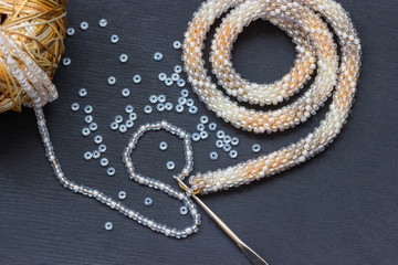Fragment of a knitted  necklace from beads