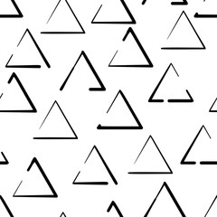 Hand drawn seamless pattern with triangles isolated on white background.