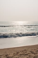 Glistening waves on beach - Glistening sea waves on a tropical beach in the morning.