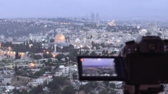 Camera shoots photo timelapse of the Jerusalem Old City view landscape. Mount Scopus is a famous Holy Land place and it has a fantastic view to the Old Jerusalem.