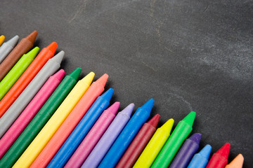 colored crayons on the blackboard