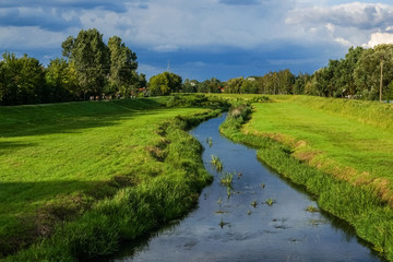 Fototapeta na wymiar Beatiful landscape with Jeziorka river in Konstancin Jeziorna, Poland
